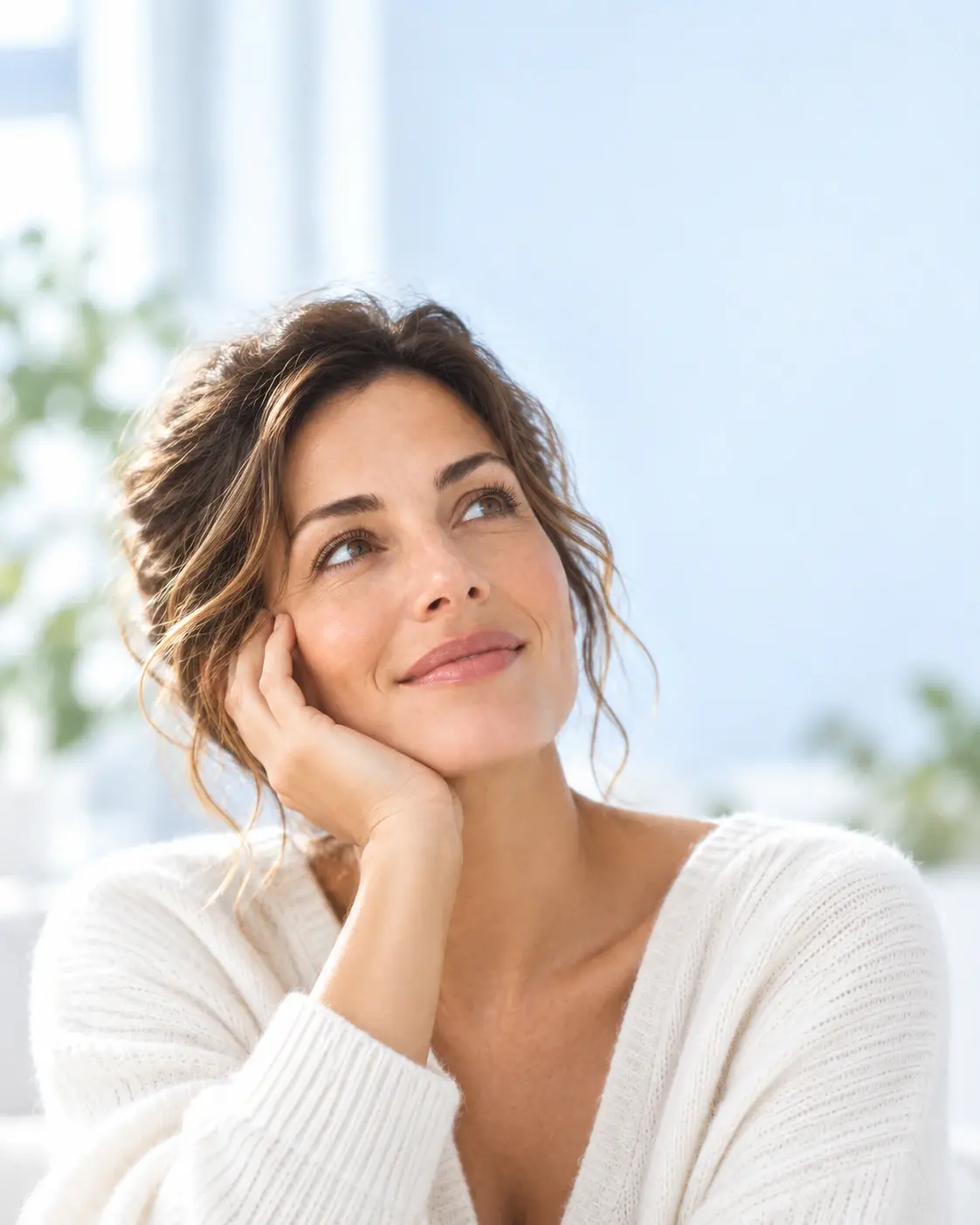 Calm, confident woman reflecting on her aesthetic possibilities
